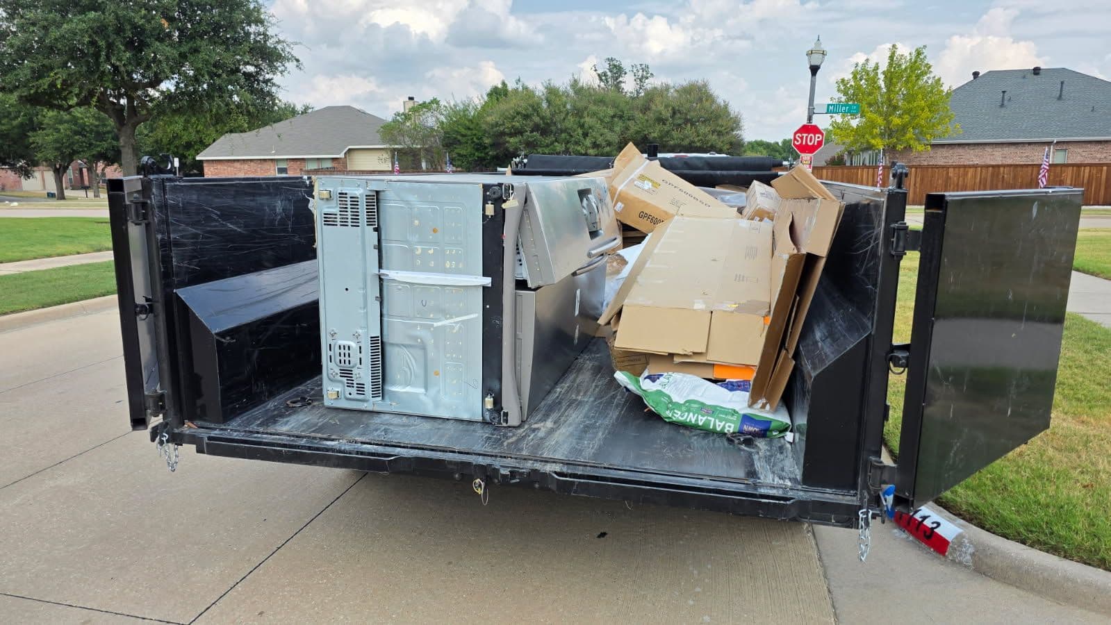 Efficient Cardboard and Appliance Disposal in Celina image