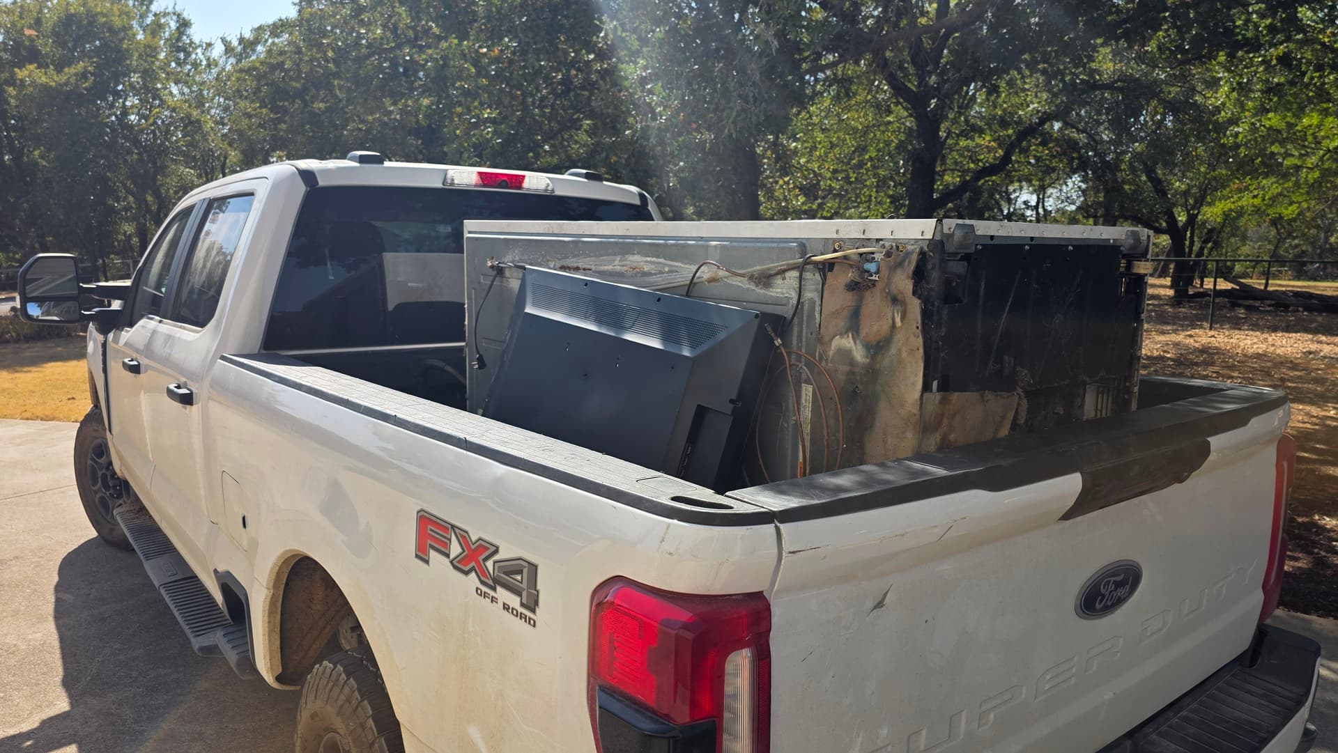 Refrigerator and TV Hauled Away in Cross Roads image